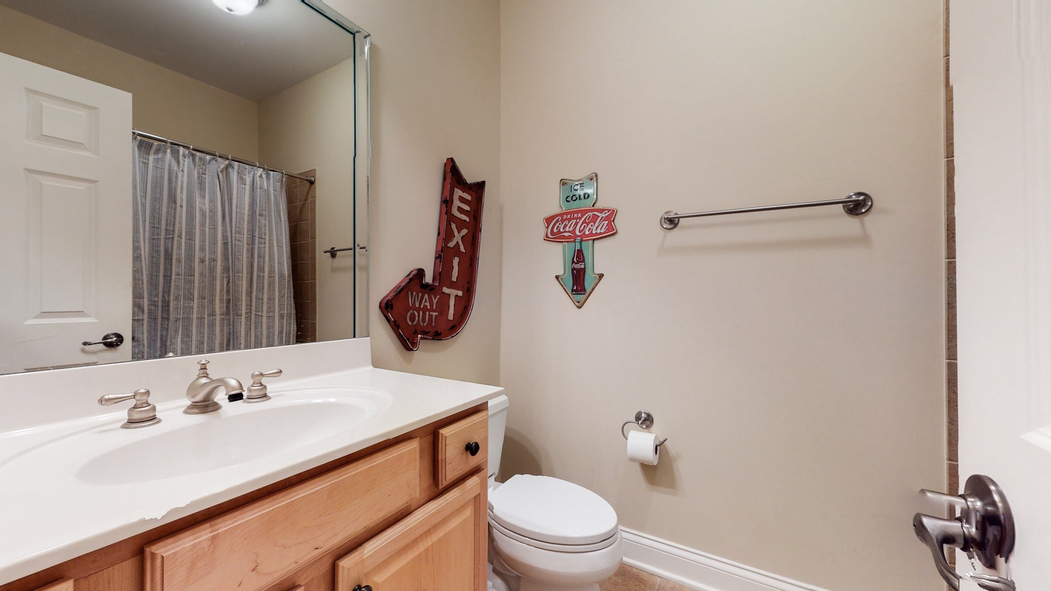 665 Springlake Drive Franklin, TN 37064 - Photo 32 of 41 a bathroom with a sink vanity mirror and toilet