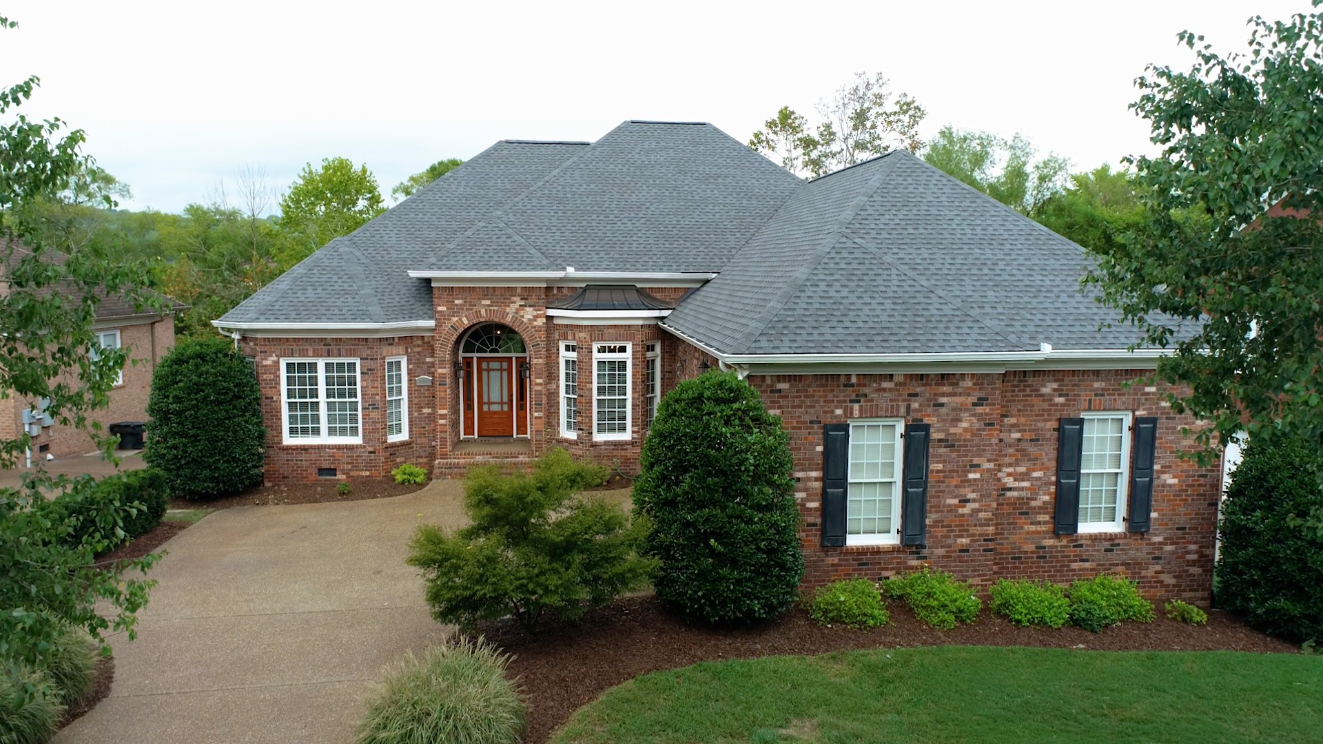 665 Springlake Drive Franklin, TN 37064 - Photo 5 of 41 a front view of a house with garden