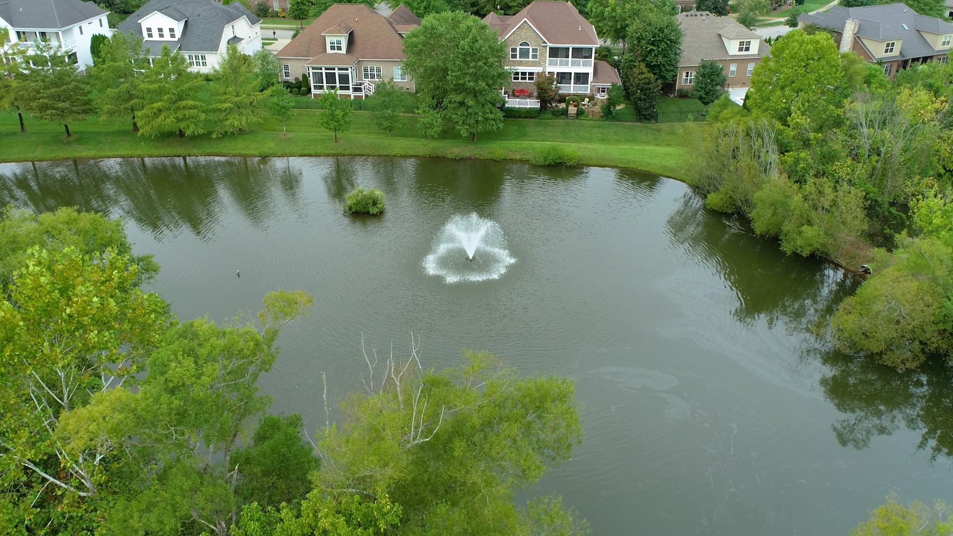 665 Springlake Drive Franklin, TN 37064 - Photo 8 of 41 an aerial view of a house with a yard and a garden