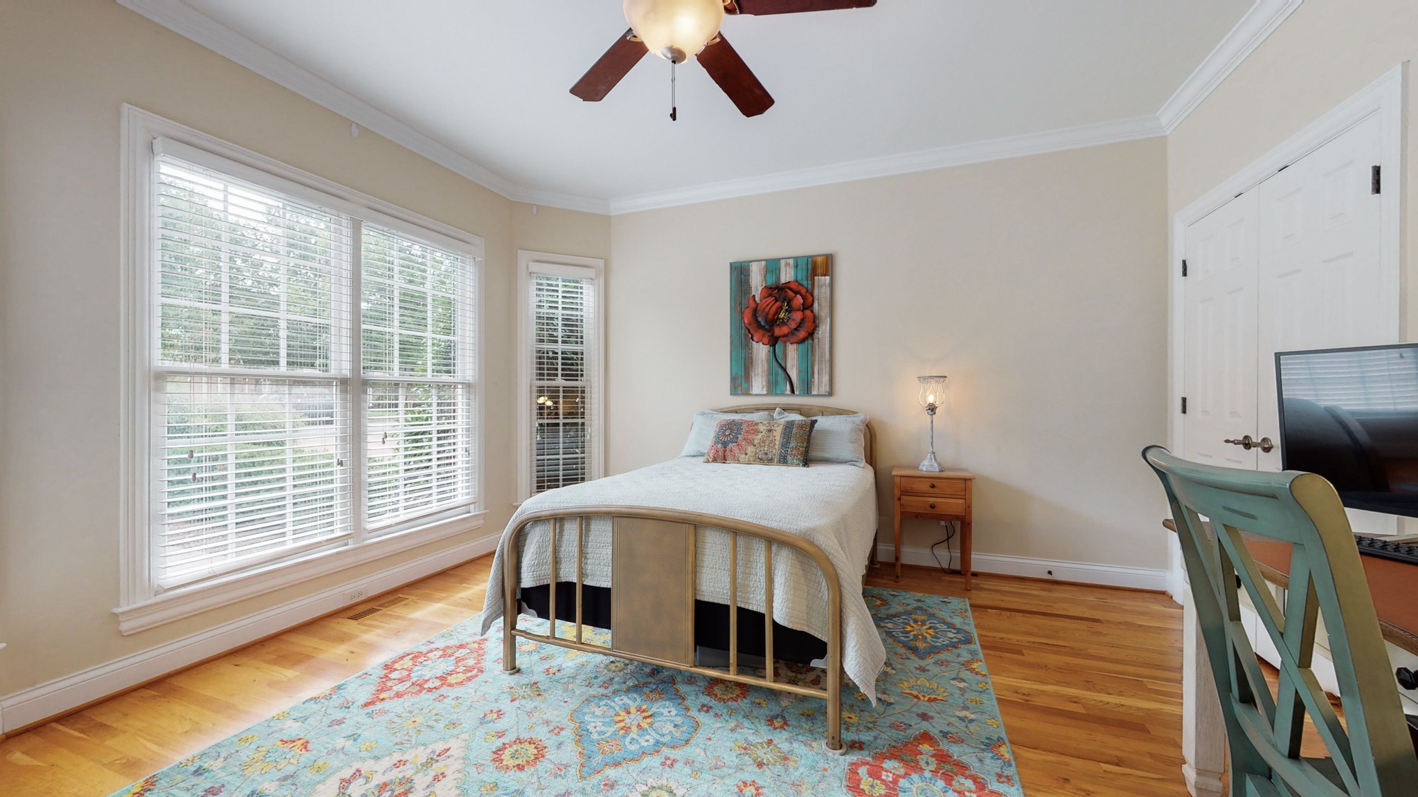 665 Springlake Drive Franklin, TN 37064 - Photo 10 of 41 a bedroom with a bed and wooden floor