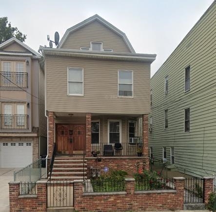 596 Adams Avenue, Unit 1 Elizabeth, NJ 07201 - Photo 1 of 11 a front view of a house with garden