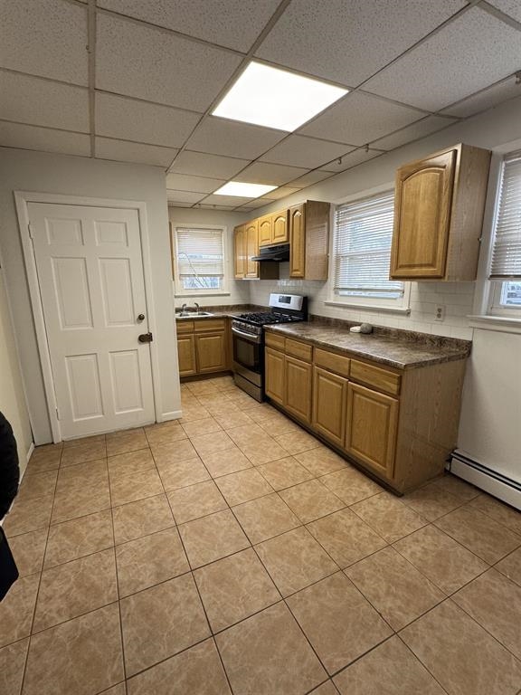 596 Adams Avenue, Unit 1 Elizabeth, NJ 07201 - Photo 4 of 11 a large kitchen with cabinets and steel stainless steel appliances