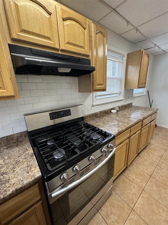596 Adams Avenue, Unit 1 Elizabeth, NJ 07201 - Photo 6 of 11 a kitchen with granite countertop a stove and a sink