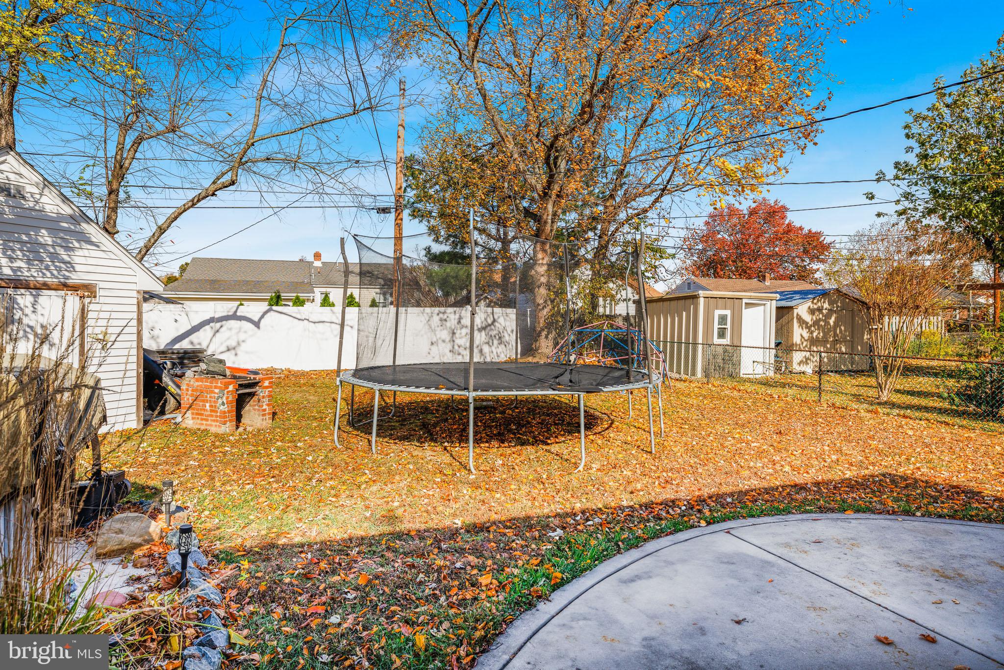 30 Tuckahoe Road New Castle, DE 19720 - Photo 35 of 40 Sunny backyard with a trampoline oasis.