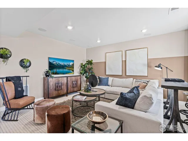 a room with furniture pool table and window