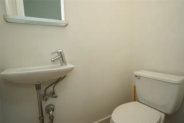 a bathroom with a toilet and a sink