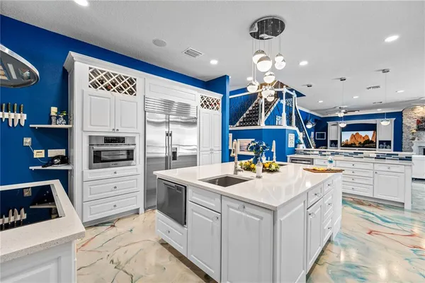 a view of a house with swimming pool and sitting area