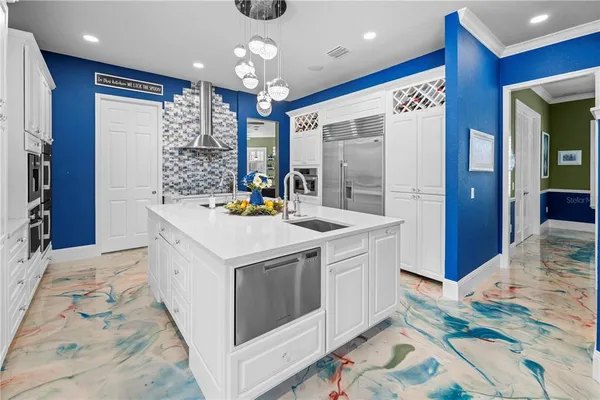 a front view of a house with swimming pool and furniture