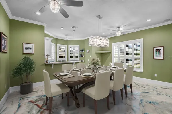 a view of a patio with furniture potted plants and palm tree
