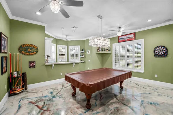 a open kitchen with a sink and wooden floor