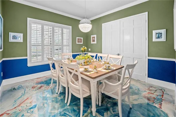 an aerial view of a house with a yard basket ball court and outdoor seating
