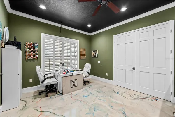 an aerial view of residential house with yard and outdoor space