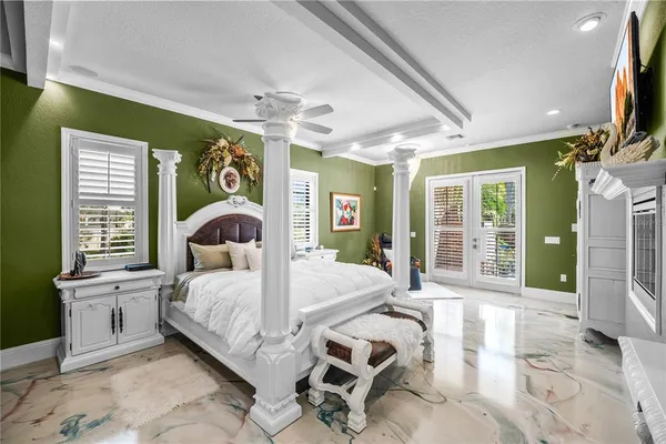 an aerial view of residential houses with outdoor space and lake view