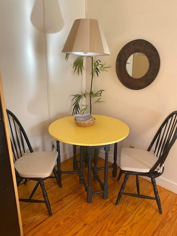 95 Main Street, Unit A Sandwich, MA 02563 - Photo 5 of 12 a view of a dining room with furniture and wooden floor