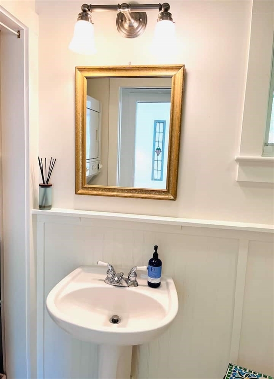 95 Main Street, Unit A Sandwich, MA 02563 - Photo 8 of 12 a bathroom with a sink and a mirror