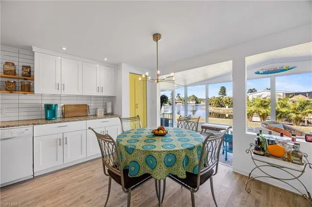 a dining room with furniture a rug and wooden floor