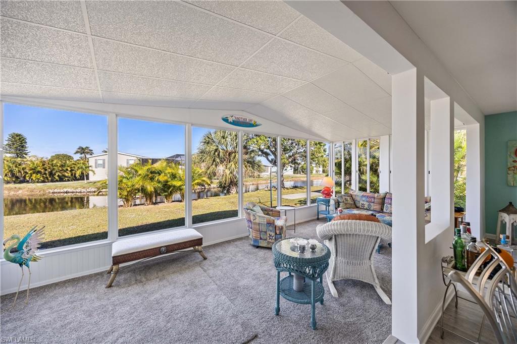 216 Rookery Road Naples, FL 34114 - Photo 24 of 44 a living room with furniture and a potted plant