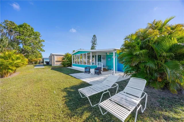 a view of an house with backyard outdoor seating area and entertaining space