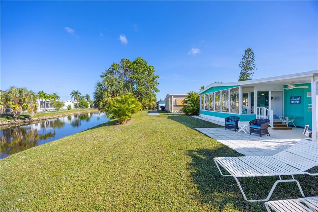 216 Rookery Road Naples, FL 34114 - Photo 31 of 44 a view of an house with backyard outdoor seating area and entertaining space