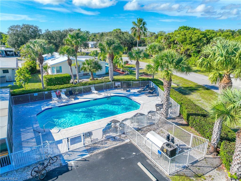 216 Rookery Road Naples, FL 34114 - Photo 33 of 44 an aerial view of a house with a yard