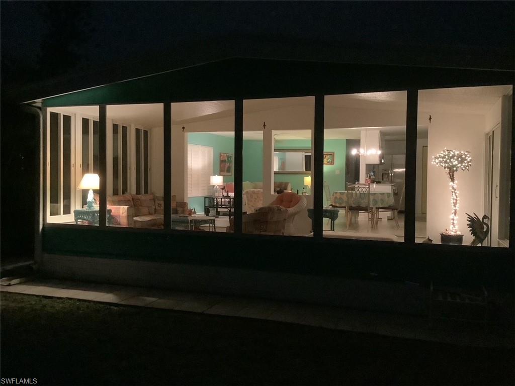 216 Rookery Road Naples, FL 34114 - Photo 44 of 44 a picture of a room with a floor to ceiling window