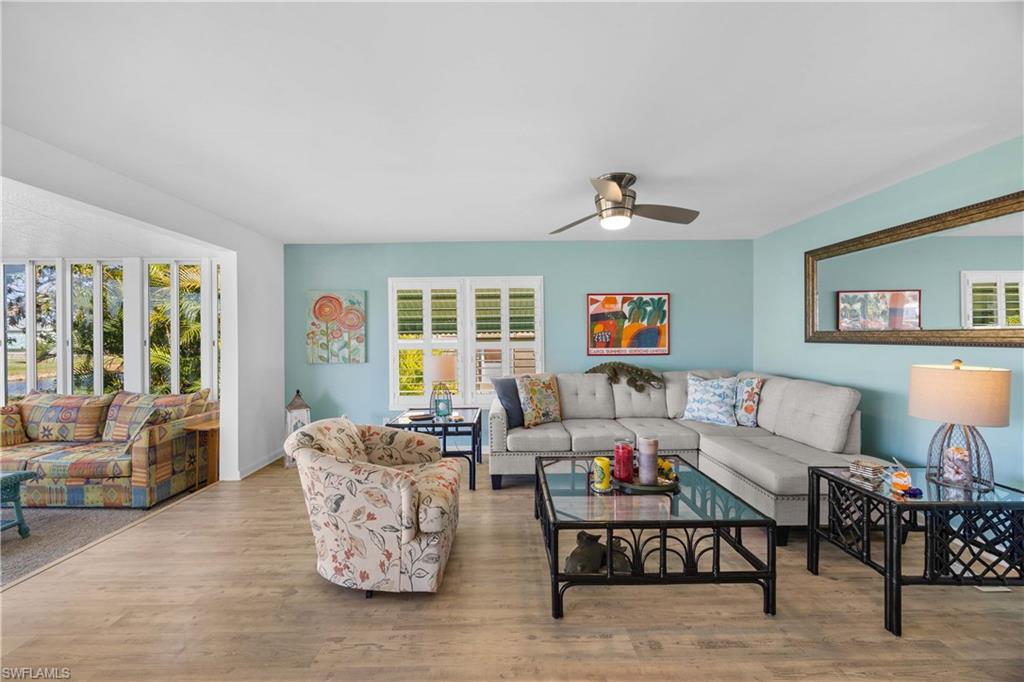 216 Rookery Road Naples, FL 34114 - Photo 7 of 44 a living room with furniture and a window