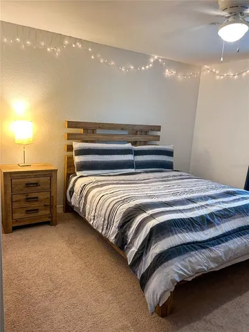 a bedroom with a bed and a dresser