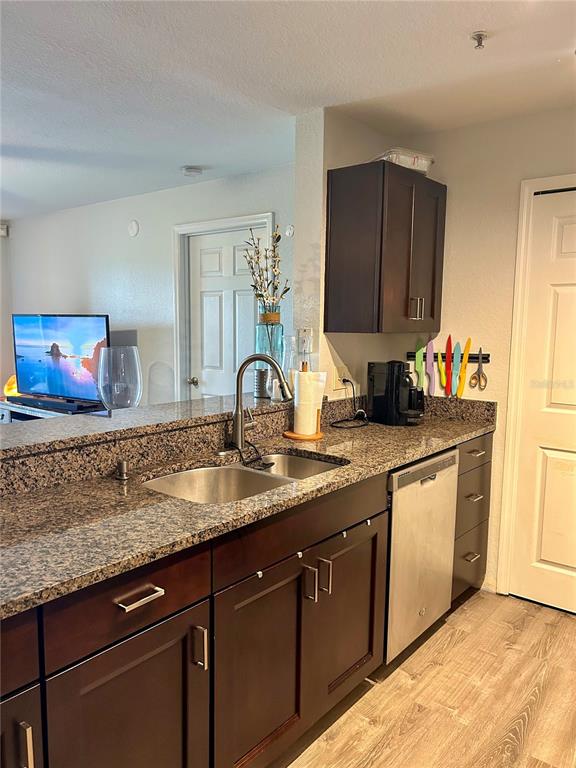 5447 Vineland Road, Unit 1209 Orlando, FL 32811 - Photo 9 of 27 a kitchen with sink and cabinets