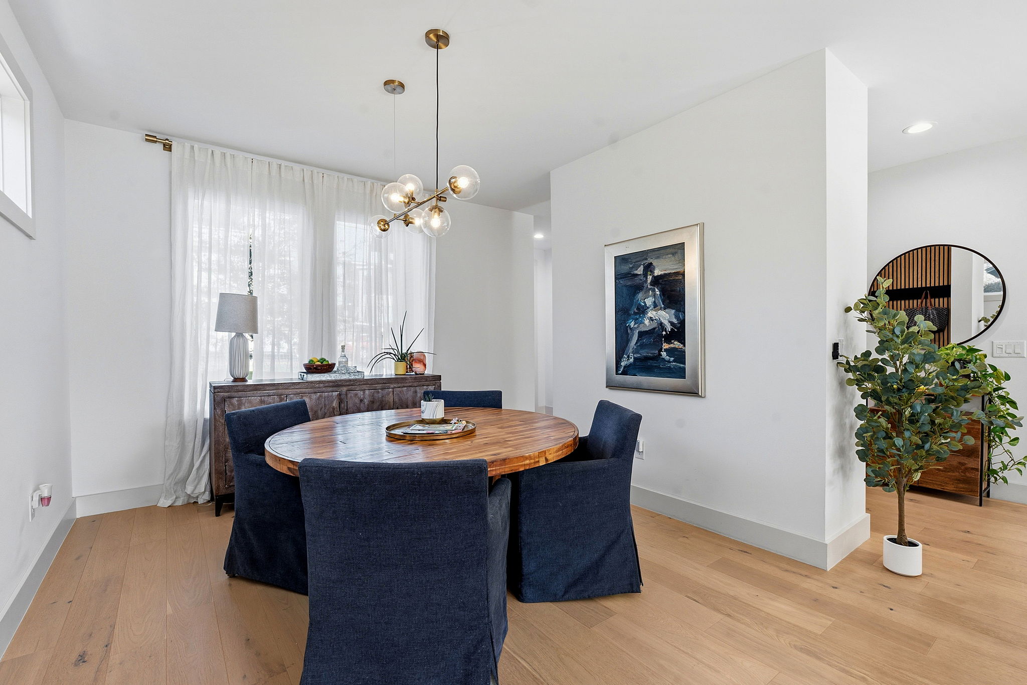 4313 Jinx Avenue, Unit 1 Austin, TX 78704 - Photo 11 of 40 Dining area featuring light wood-style flooring and hanging lights