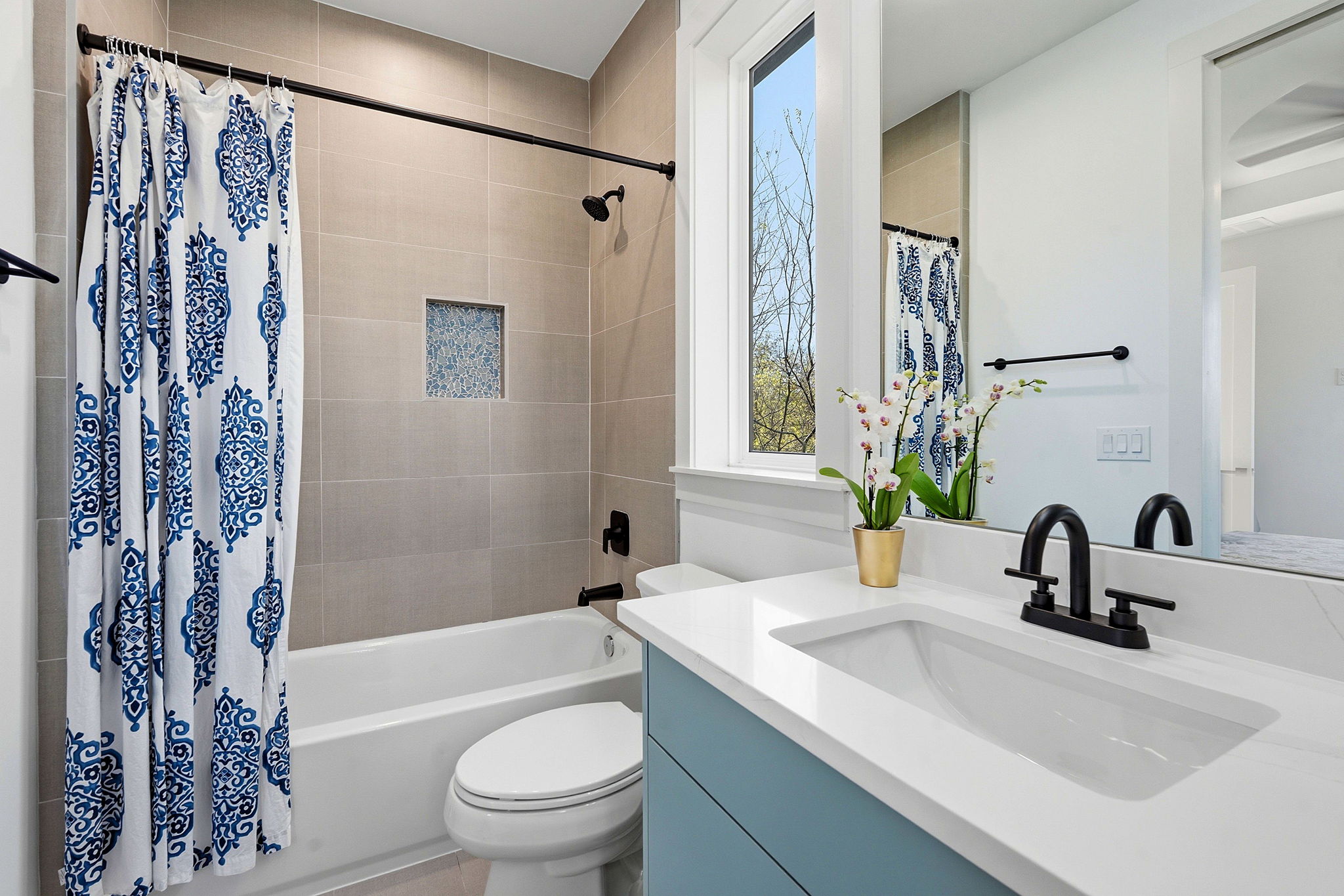 4313 Jinx Avenue, Unit 1 Austin, TX 78704 - Photo 24 of 40 Full bathroom featuring vanity and shower / bath combo with shower curtain