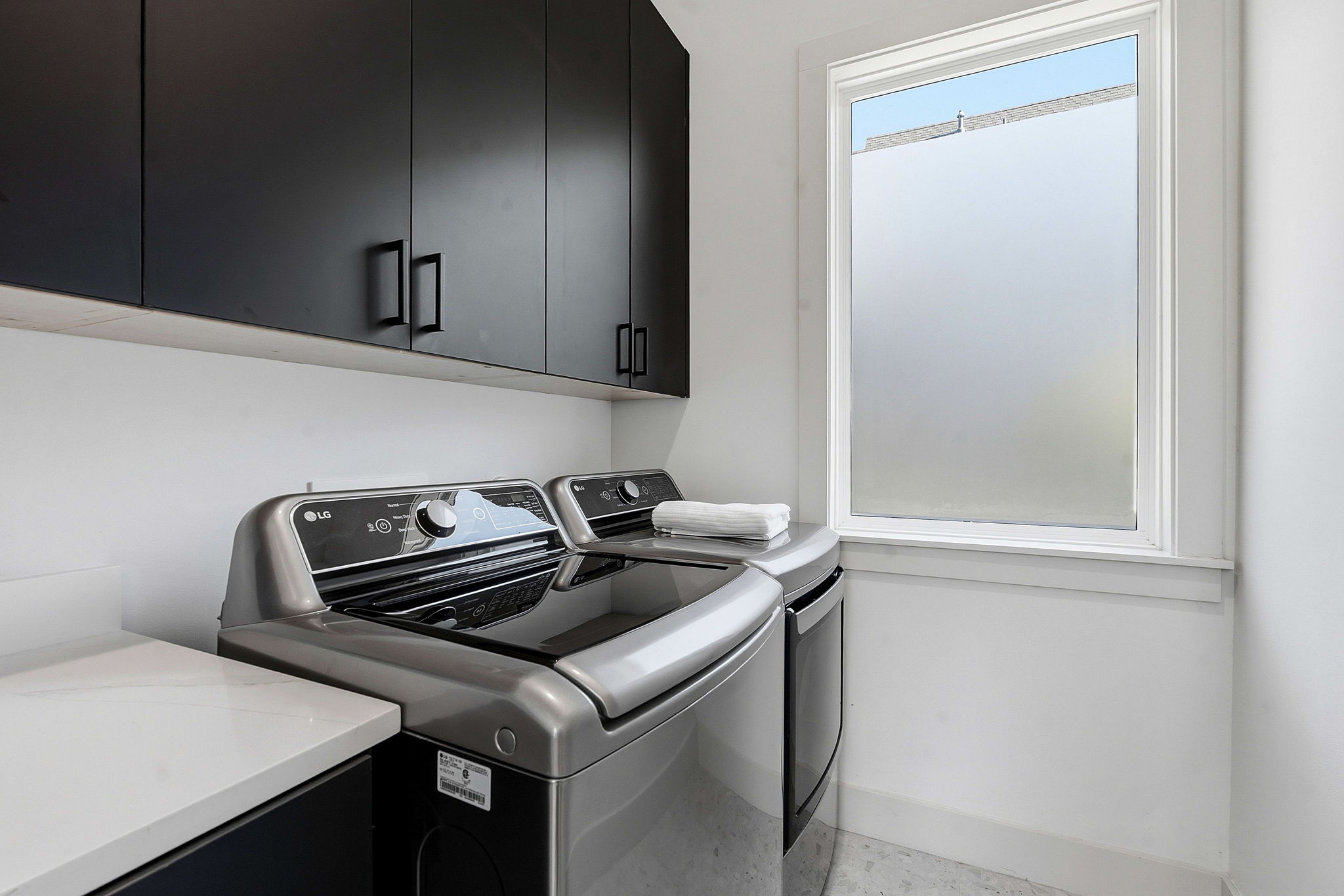 4313 Jinx Avenue, Unit 1 Austin, TX 78704 - Photo 28 of 40 Laundry room featuring washer and dryer and cabinet space