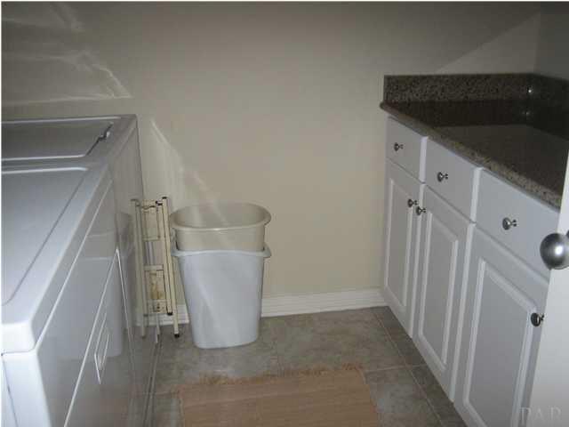 16076 Innerarity Point Road Pensacola, FL 32507 - Photo 16 of 24 Laundry room has granite countertops and plenty of storage.