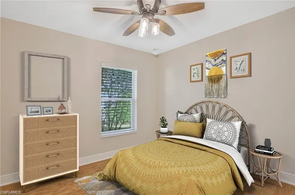 a bedroom with a bed and a dresser