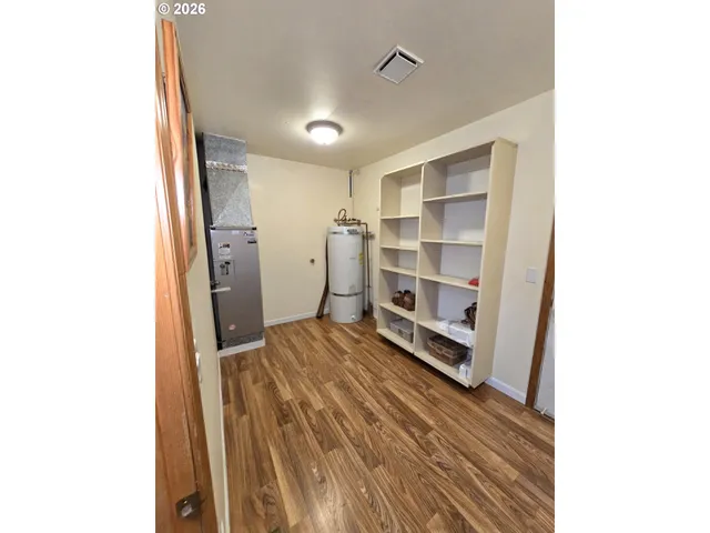 a room with a bed and cabinets