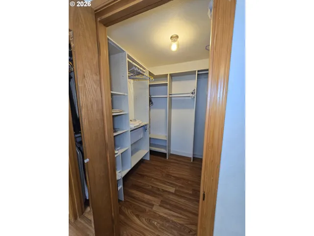 a view of an entryway with wooden floor