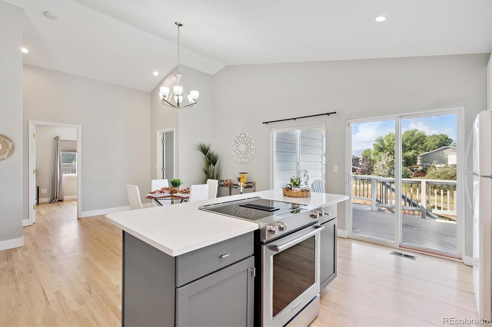 9793 Burberry Way Highlands Ranch, CO 80129 - Photo 11 of 29 a kitchen that has a lot of cabinets in it