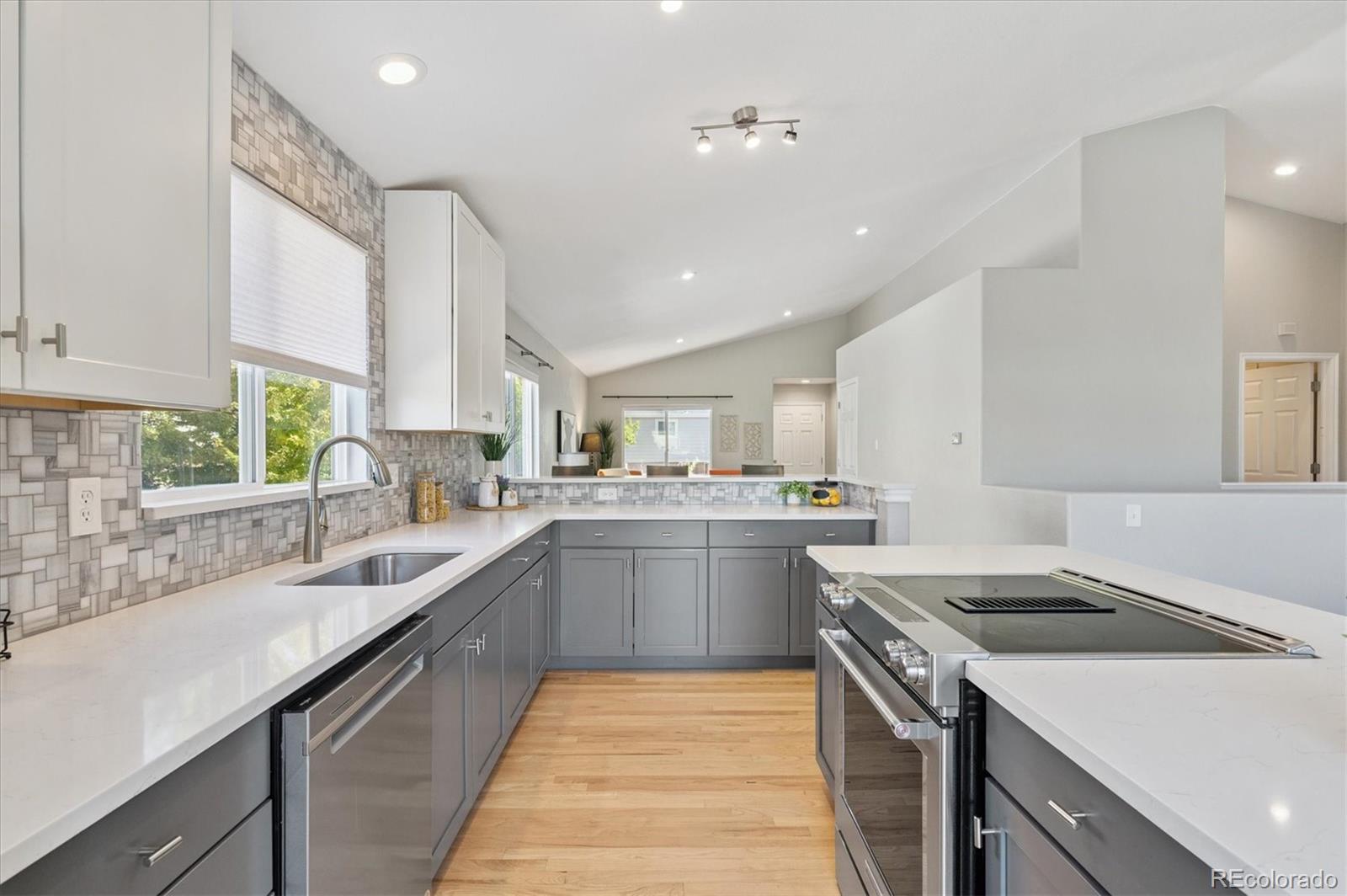 9793 Burberry Way Highlands Ranch, CO 80129 - Photo 12 of 29 a kitchen with a sink stove and cabinets