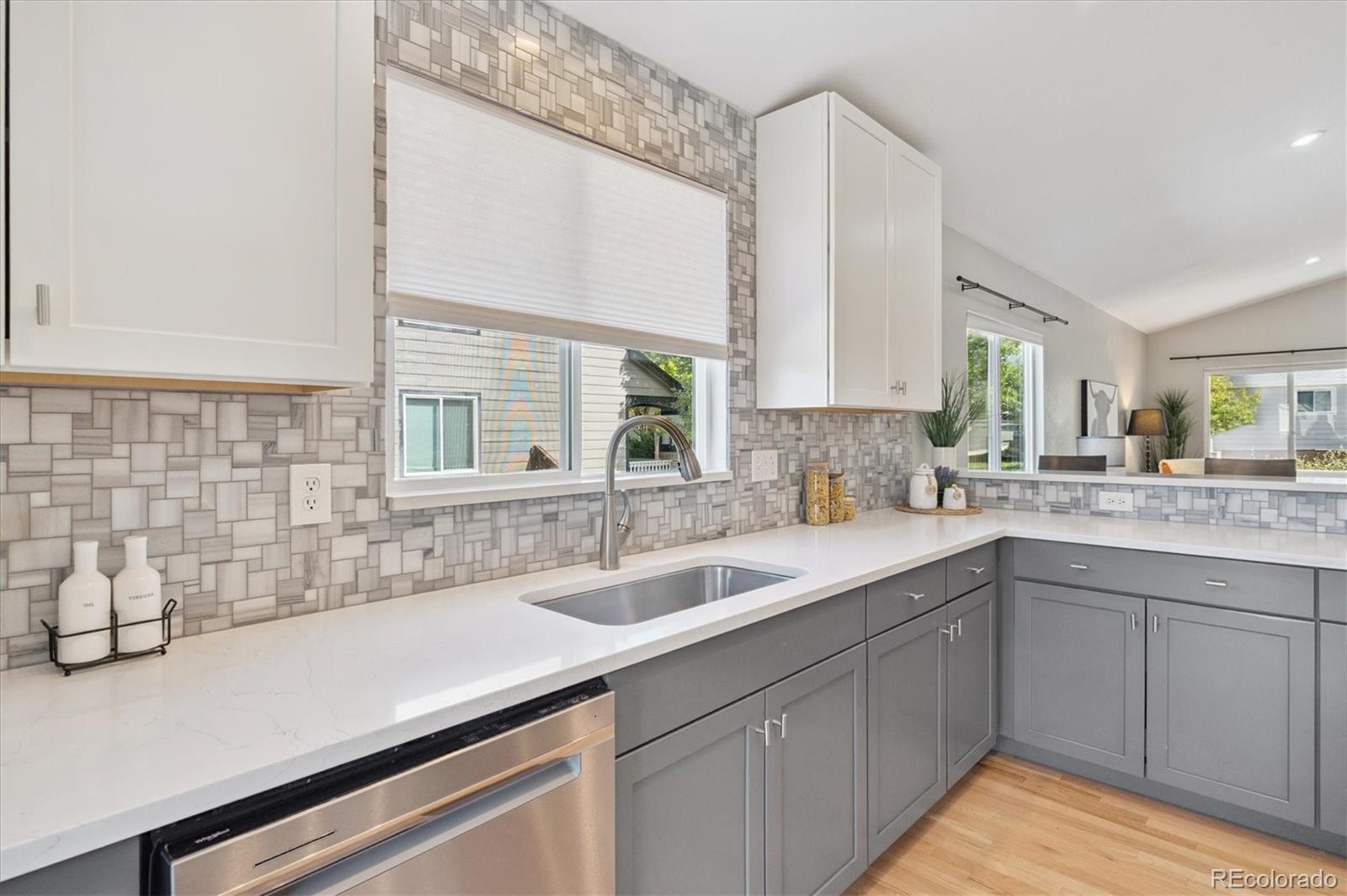 9793 Burberry Way Highlands Ranch, CO 80129 - Photo 13 of 29 a kitchen with a sink and cabinets