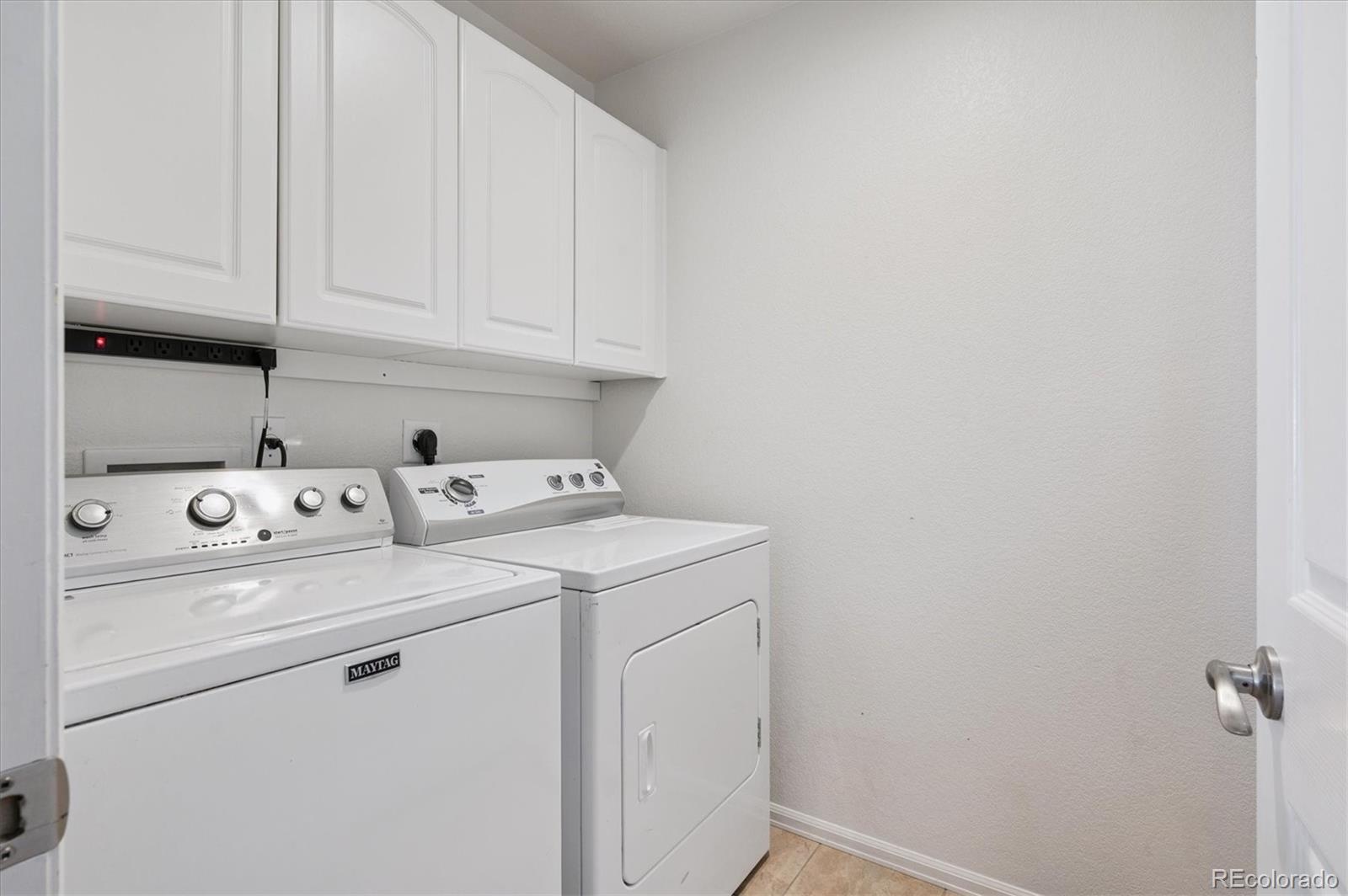 9793 Burberry Way Highlands Ranch, CO 80129 - Photo 21 of 29 a utility room with dryer and washer