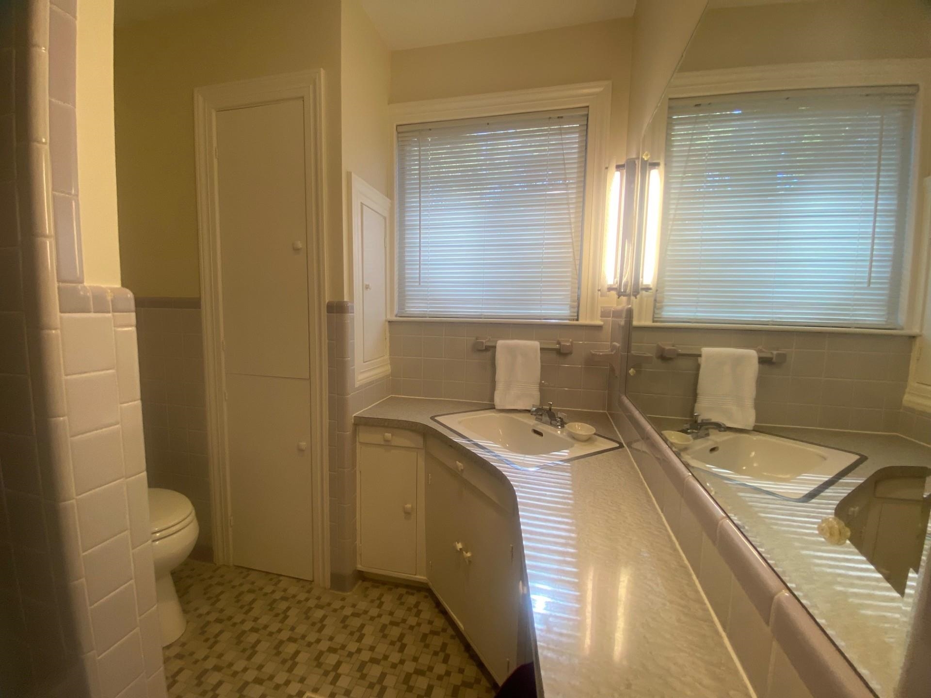 40 North Acres Drive Jackson, TN 38301 - Photo 12 of 24 a bathroom with a sink a toilet and window