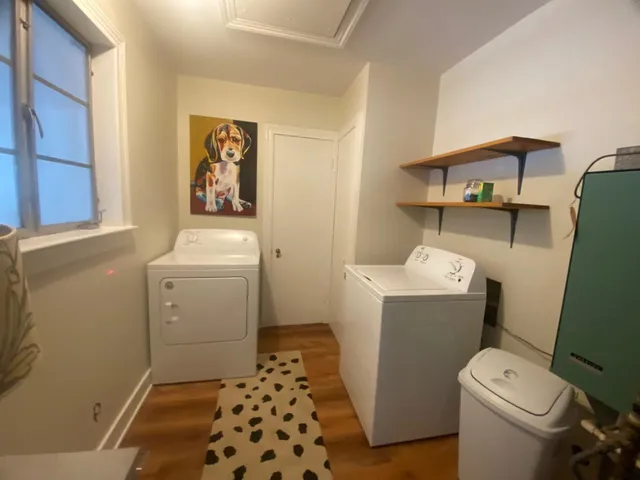 a bathroom with a toilet and a shower curtain
