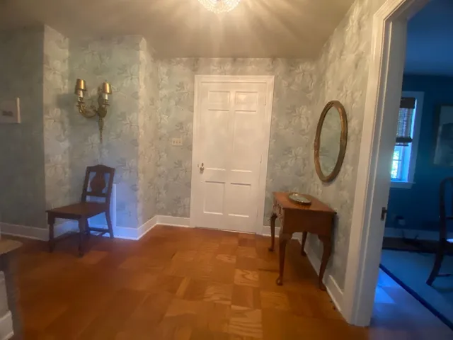 a view of a livingroom with furniture and a mirror
