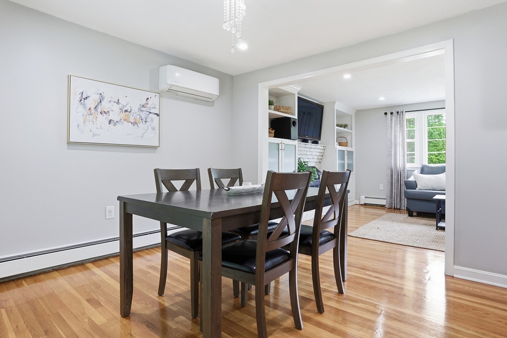 33 Simon Willard Road Acton, MA 01720 - Photo 13 of 42 a view of a dining room with furniture and wooden floor