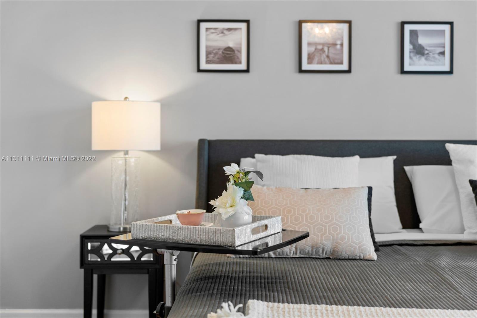 18100 North Bay Road, Unit 308 Sunny Isles Beach, FL 33160 - Photo 1 of 35 a living room with a couch