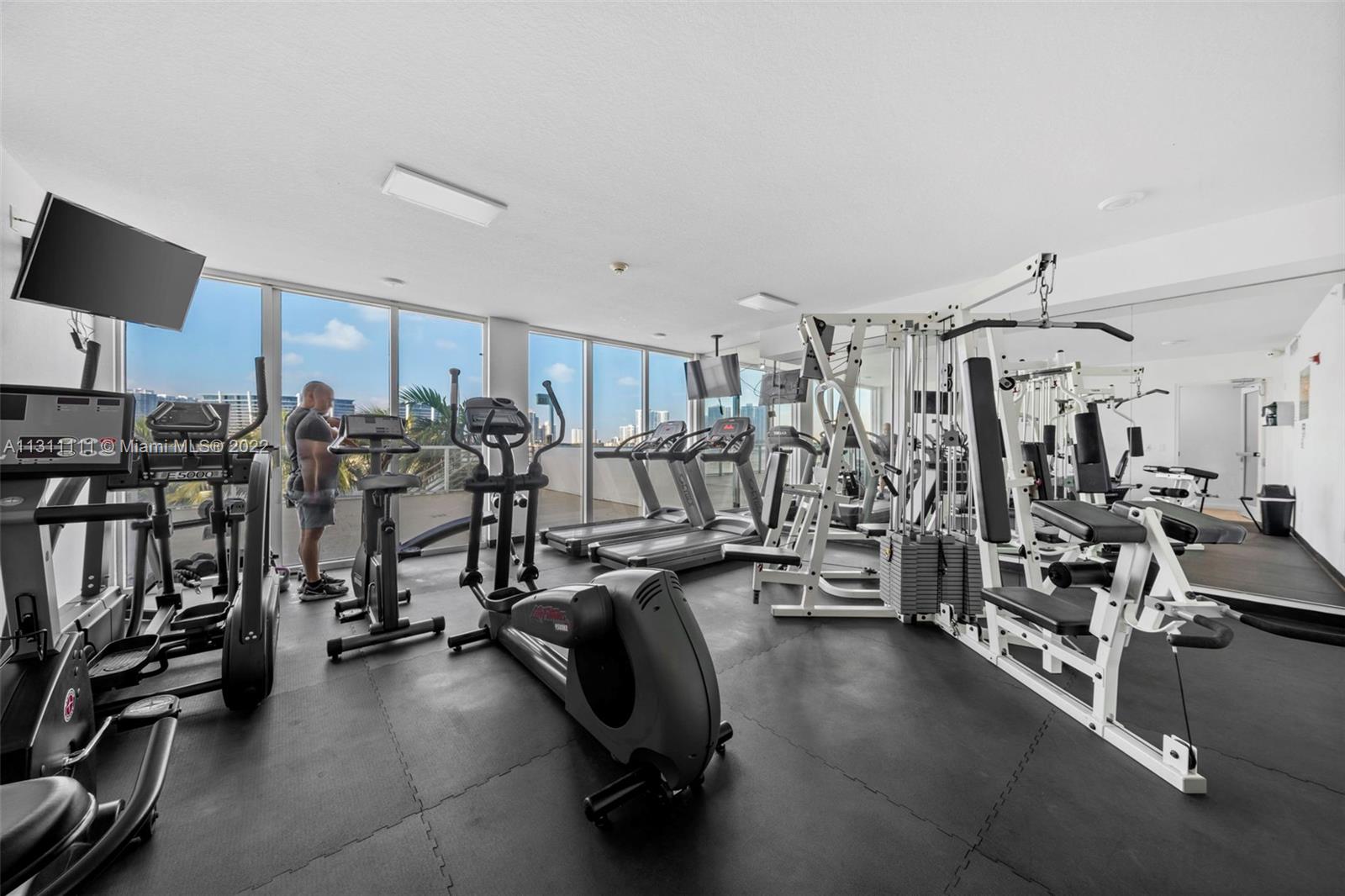 18100 North Bay Road, Unit 308 Sunny Isles Beach, FL 33160 - Photo 19 of 35 a view of a room with gym equipment