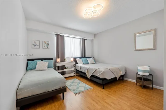 a bed room with a bed and a chair