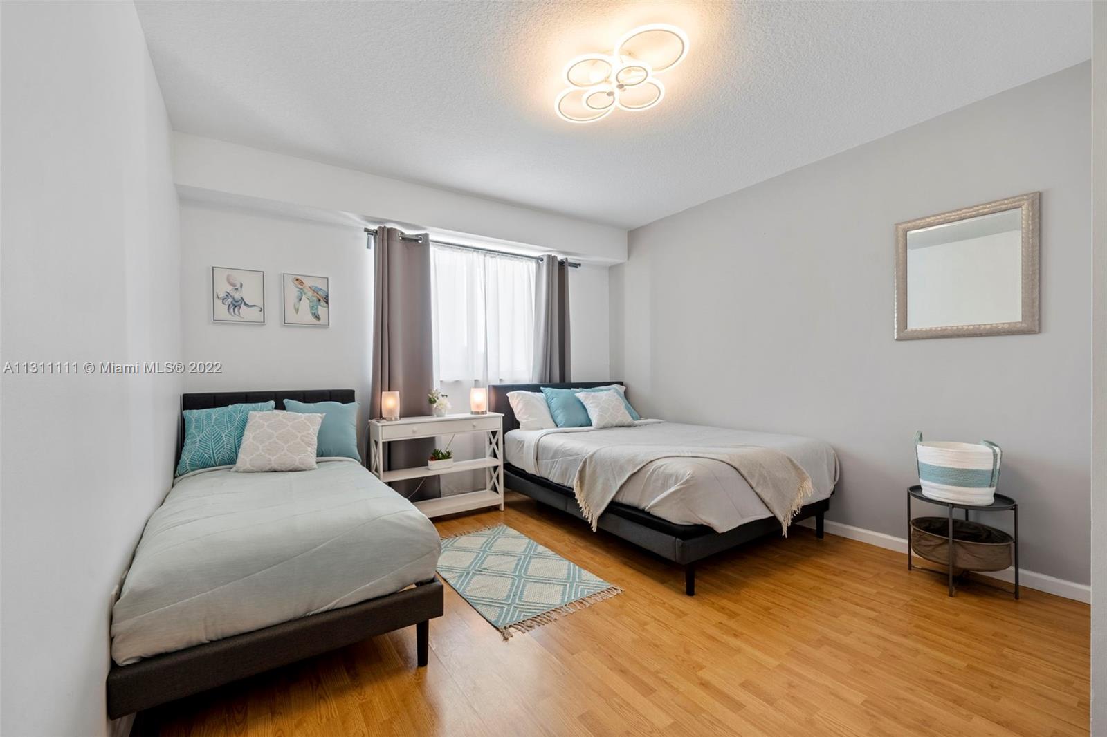 18100 North Bay Road, Unit 308 Sunny Isles Beach, FL 33160 - Photo 31 of 35 a bed room with a bed and a chair