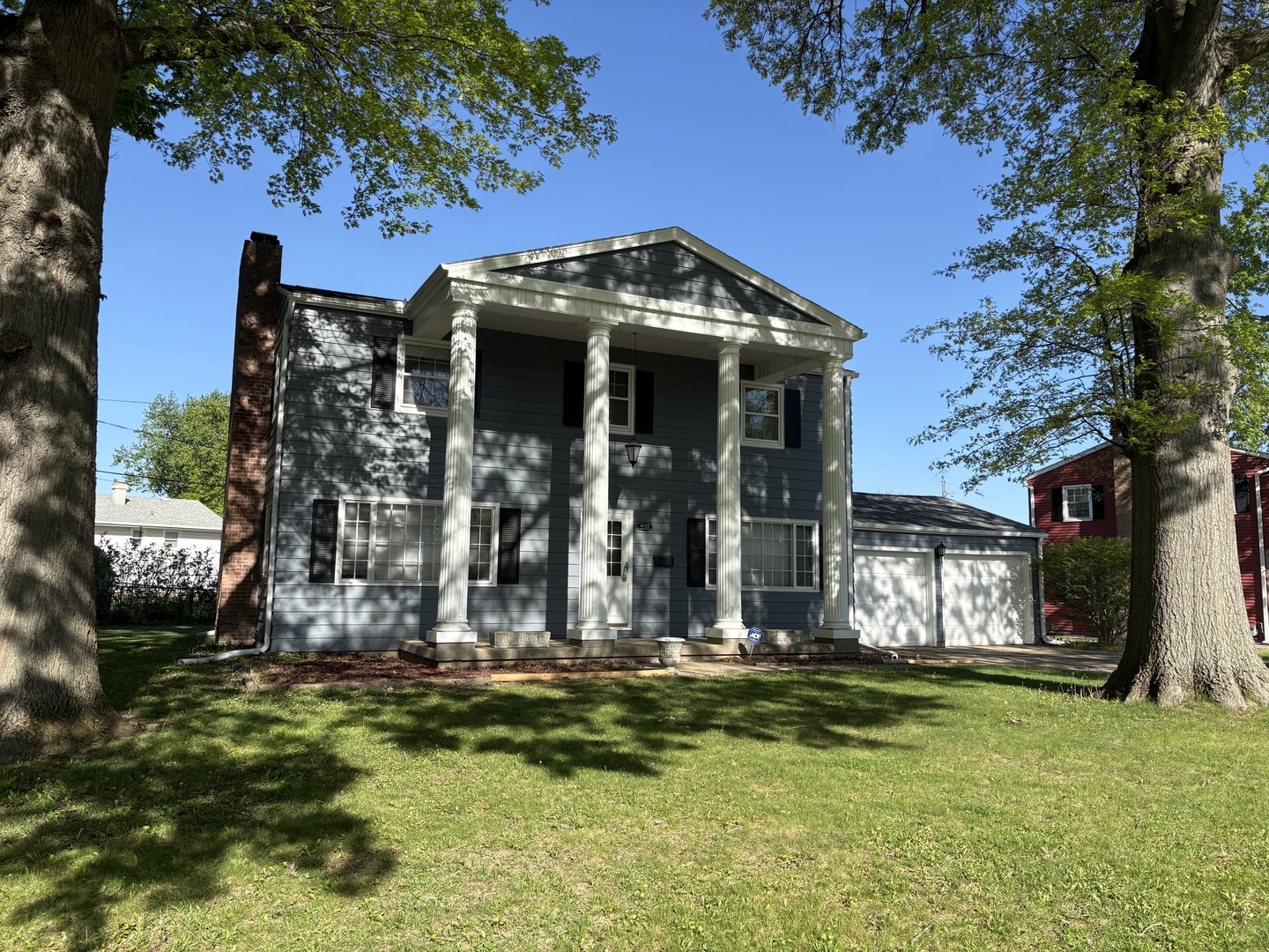 a view of a house with fountain bath tub and trees around