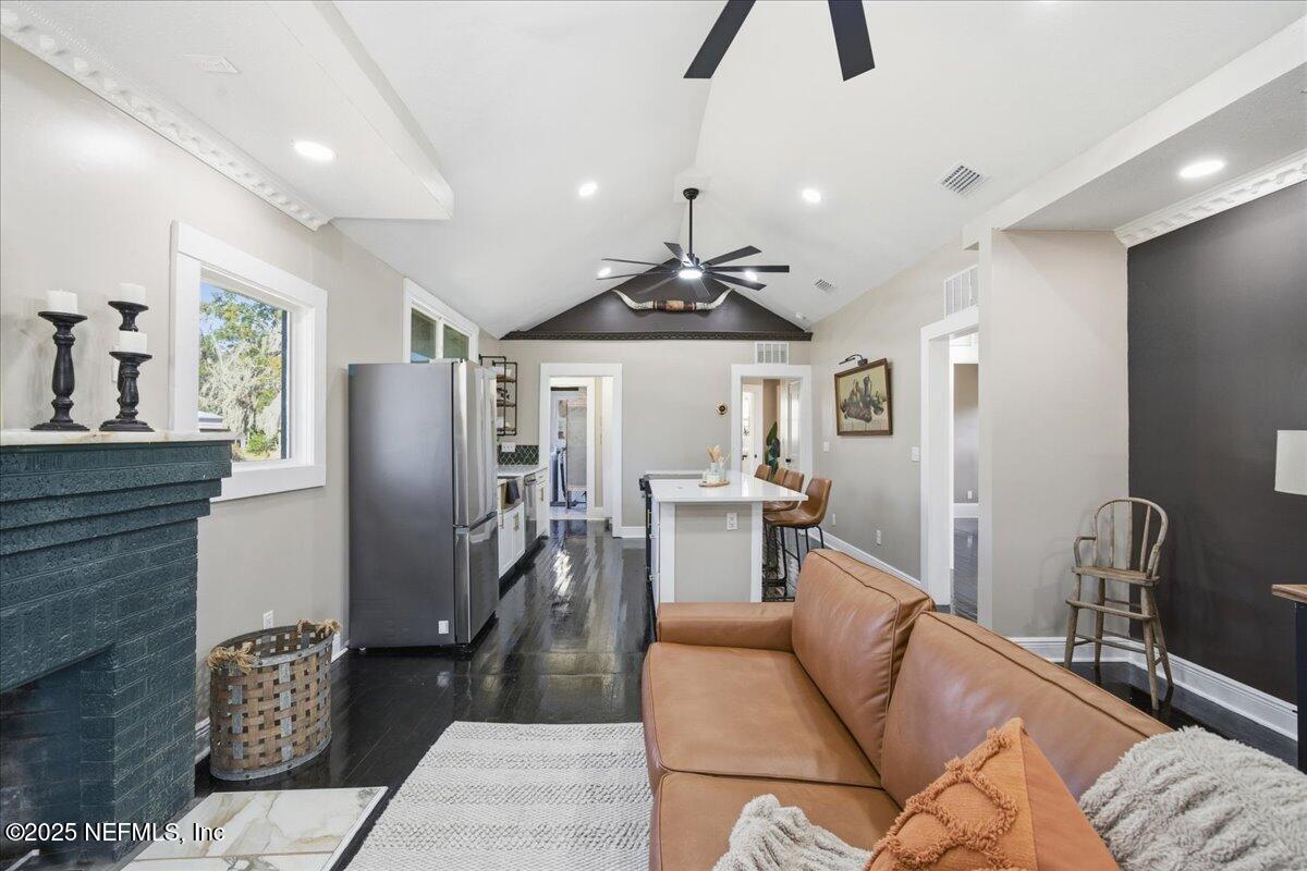 9671 Old Plank Road Jacksonville, FL 32220 - Photo 11 of 62 a living room with furniture a dining table and chairs