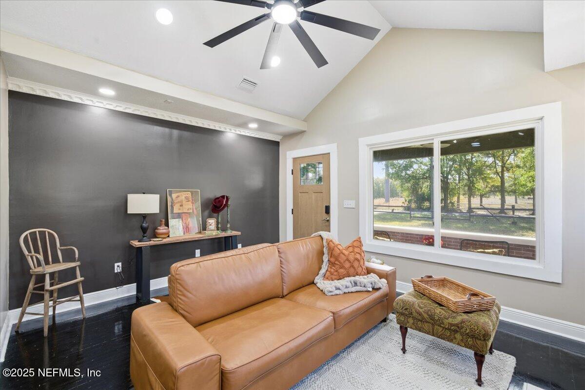 9671 Old Plank Road Jacksonville, FL 32220 - Photo 12 of 62 a living room with furniture and a large window